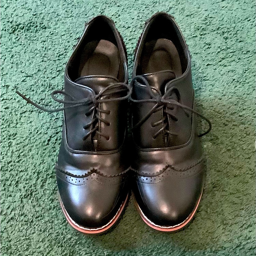 Women’s black oxfords, size 8.